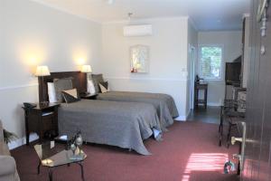 Voodi või voodid majutusasutuse Lodge Bordeaux toas