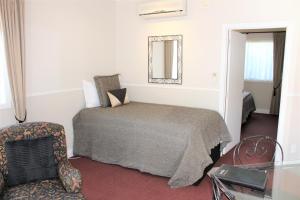 Voodi või voodid majutusasutuse Lodge Bordeaux toas