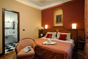 Postel nebo postele na pokoji v ubytování Hotel Farnese