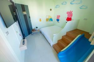 Letto o letti in una camera di Kids Heart Home