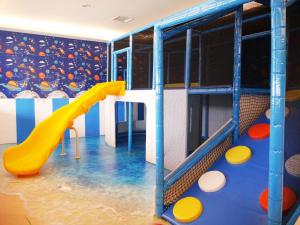 a play room with a slide and a slide at Dubai Villa Motel in Daya