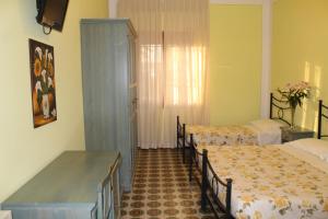 Postel nebo postele na pokoji v ubytování Hotel Ismaele