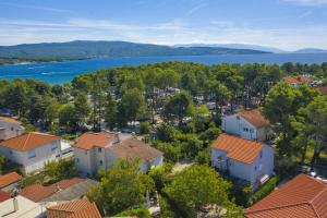 an aerial view of a town with houses and a lake at Apartments Irena Krk in Krk