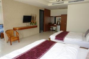 Postel nebo postele na pokoji v ubytování Hualien Sheraton Hostel