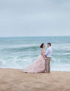 a bride and groom standing on the beach at IRONWOOD LODGE in Pennington