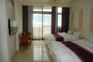 Postel nebo postele na pokoji v ubytování Hualien Sheraton Hostel