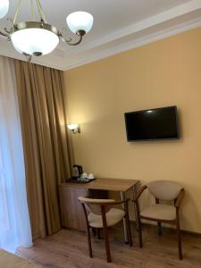 TV a/nebo společenská místnost v ubytování Сонячна Соната