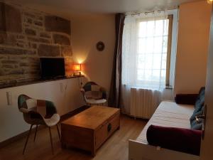 Postel nebo postele na pokoji v ubytování Les Chambres du Château du Rozel