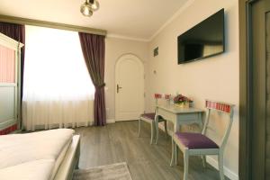 Un televizor și/sau centru de divertisment la Casa Kempel