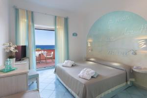 Una cama o camas en una habitación de Hotel Corallaro