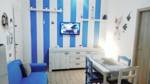 TV a/nebo společenská místnost v ubytování Casa Vacanze Trinacria