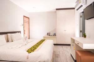 Postel nebo postele na pokoji v ubytování Neptuna Hotel