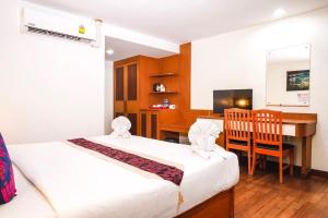 Postel nebo postele na pokoji v ubytování Neptuna Hotel