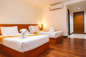 Postel nebo postele na pokoji v ubytování Neptuna Hotel