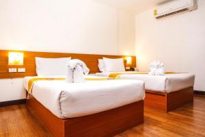 Postel nebo postele na pokoji v ubytování Neptuna Hotel