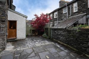 an alleyway between two old stone buildings at Fairmead in Ambleside