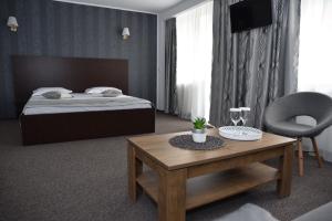 Postel nebo postele na pokoji v ubytování Hotel Magurele