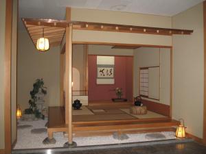 an inside view of a temple with a room with a japanificialificialificial at Hotel Towadaso in Towada