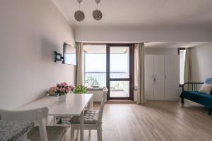 a living room with a table and a dining room at BINIS Apartment in Funchal
