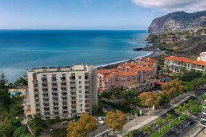 an aerial view of a building next to the ocean at BINIS Apartment in Funchal