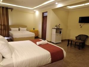 Ένα ή περισσότερα κρεβάτια σε δωμάτιο στο Lantana Comfy