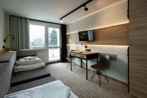 Postel nebo postele na pokoji v ubytování Hotel Halo Szczyrk