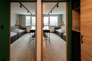 Postel nebo postele na pokoji v ubytování Hotel Halo Szczyrk