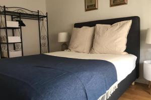 מיטה או מיטות בחדר ב-Olá Lisbon - Alcantara I
