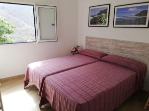 A bed or beds in a room at Casa Lita