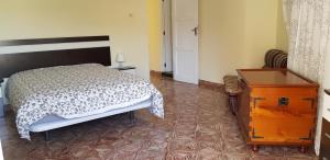 Giường trong phòng chung tại Quinta Miramar