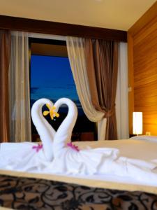 Postel nebo postele na pokoji v ubytování Suppamitr Villa Hotel