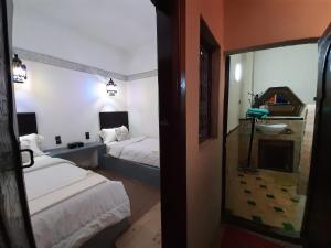 Ein Bett oder Betten in einem Zimmer der Unterkunft Riad Ma Bohème