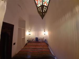 Ένα ή περισσότερα κρεβάτια σε δωμάτιο στο Riad Ma Bohème