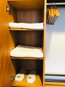 a cupboard with two toilets and towels in it at Barkod Otel in Istanbul +68 photos