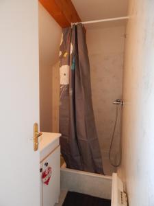 a shower in a bathroom with a shower curtain at ROYAL in Germ +9 photos