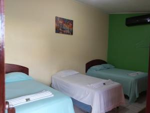 Postelja oz. postelje v sobi nastanitve Mados Hotel Tamarindo