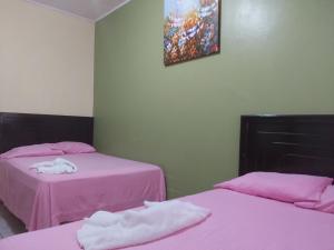 Postelja oz. postelje v sobi nastanitve Mados Hotel Tamarindo