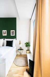 Säng eller sängar i ett rum på Boutique Design-Apartments Vienna