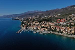an aerial view of a town on the water at Apartments Komel in Opatija