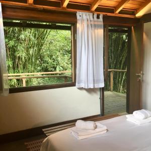 Cama ou camas em um quarto em O Sitio - Ilha Grande