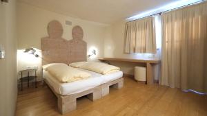 Postel nebo postele na pokoji v ubytování Chalet C'Est La Vie