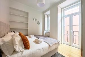 Giường trong phòng chung tại Casa Portuguesa Fanqueiros