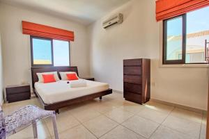 Postel nebo postele na pokoji v ubytování Villa Anatoli - Cape Greco