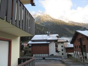 a view from the balcony of a house with a mountain at appartement 4 personnes Armancette in Les Contamines-Montjoie