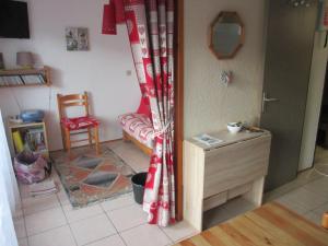 a living room with a couch and a chair at appartement 4 personnes Armancette in Les Contamines-Montjoie