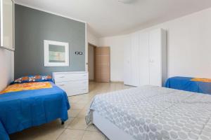 Ένα ή περισσότερα κρεβάτια σε δωμάτιο στο Casa Vacanza Aurora 6-8 posti letto