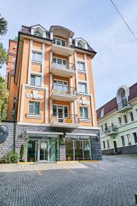 a large brick building with windows on a street at Sibirskoe Podvorie in Vladivostok