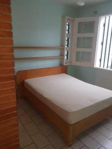 En eller flere senge i et værelse på Casa aBeira Mar 200 metros da praia Peruíbe