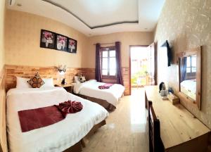 Postel nebo postele na pokoji v ubytování Dang Khoa Garden Inn Homestay