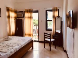 Postel nebo postele na pokoji v ubytování Mountain View Garden Inn Coron